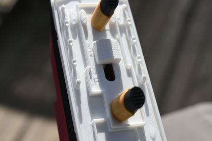 Close-up of the submersible Starlight Edition Titanic model thumb switch.