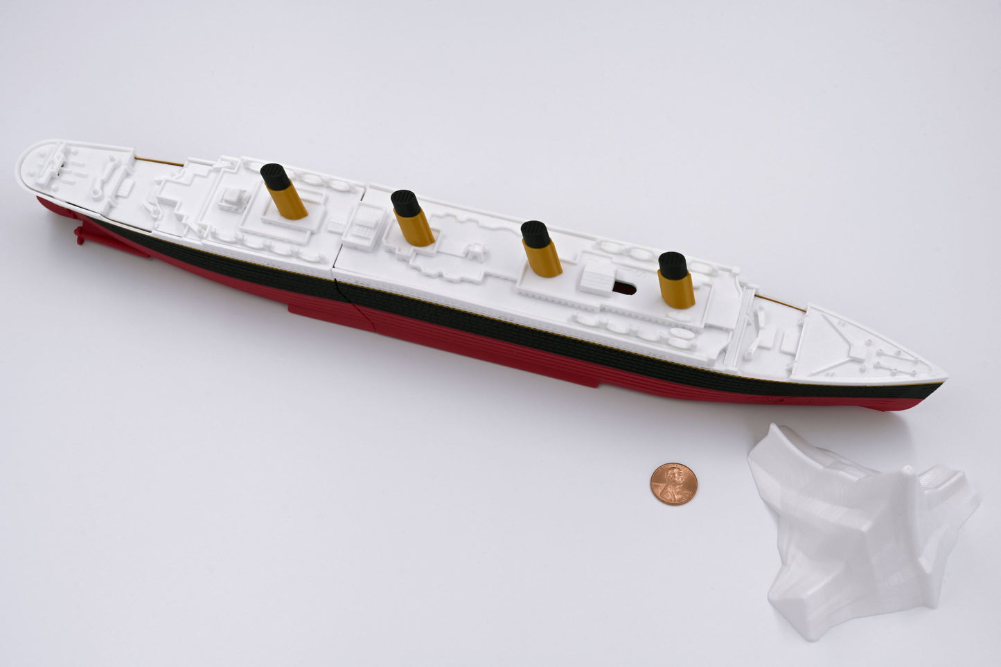 The submersible Starlight Edition Titanic model with Iceberg - with penny for scale.